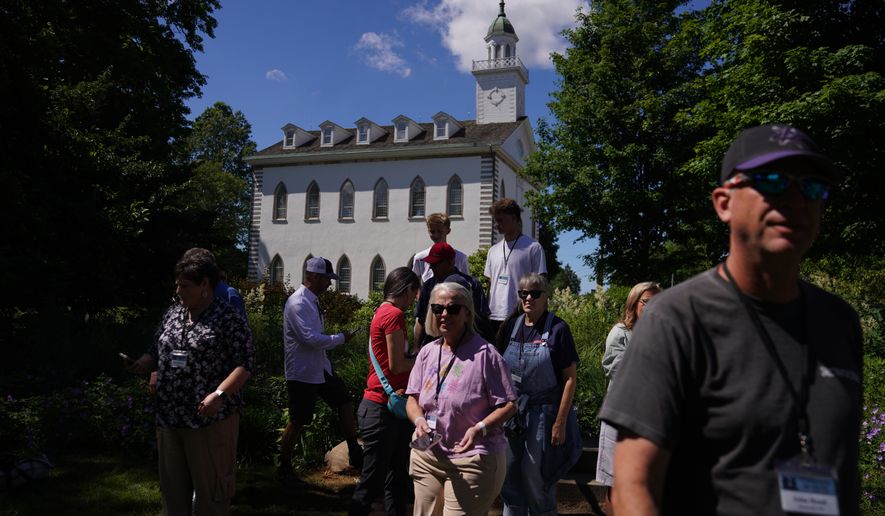 A tour group of Latter-day Saints visits the Kirtland temple site, a nearly two-century old sanctuary considered the first temple in the movement Joseph Smith founded, on Wednesday, June 15, 2026, in Kirtland, Ohio. (AP Photo/Jessie Wardarski)