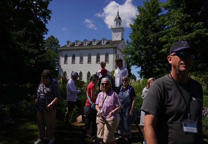 A tour group of Latter-day Saints visits the Kirtland temple site, a nearly two-century old sanctuary considered the first temple in the movement Joseph Smith founded, on Wednesday, June 15, 2026, in Kirtland, Ohio. (AP Photo/Jessie Wardarski)