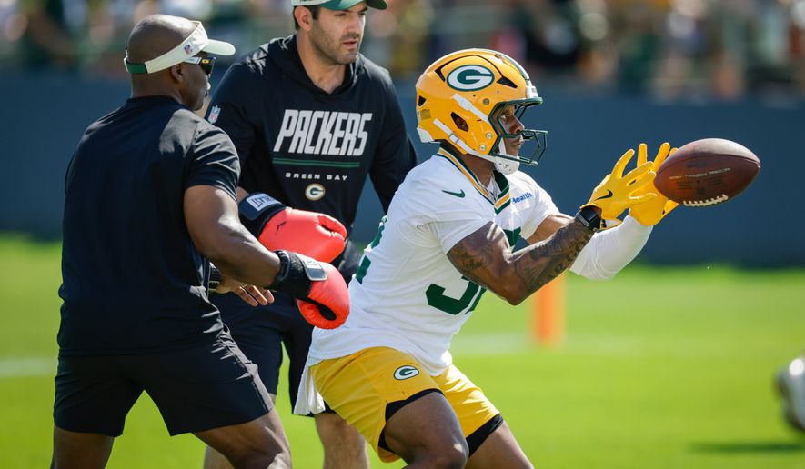 FILE - Green Bay Packers running back Marshawn Lloyd (32) runs a drill during practice at the team's NFL football training camp, Wednesday, July 29, 2026, in Green Bay, Wis. (AP Photo/Matt Ludtke, File)