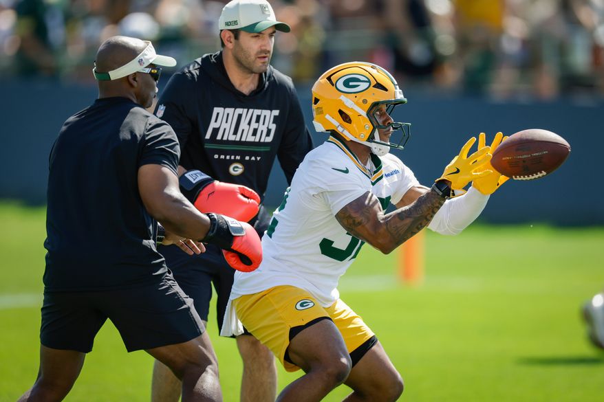 FILE - Green Bay Packers running back Marshawn Lloyd (32) runs a drill during practice at the team's NFL football training camp, Wednesday, July 29, 2026, in Green Bay, Wis. (AP Photo/Matt Ludtke, File)