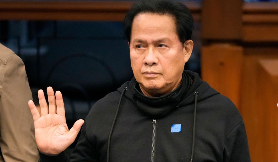FILE - Apollo Quiboloy takes his oath as he attends a hearing at the Philippine Senate on Oct. 23, 2024, in Manila, Philippines. (AP Photo/Aaron Favila, File)