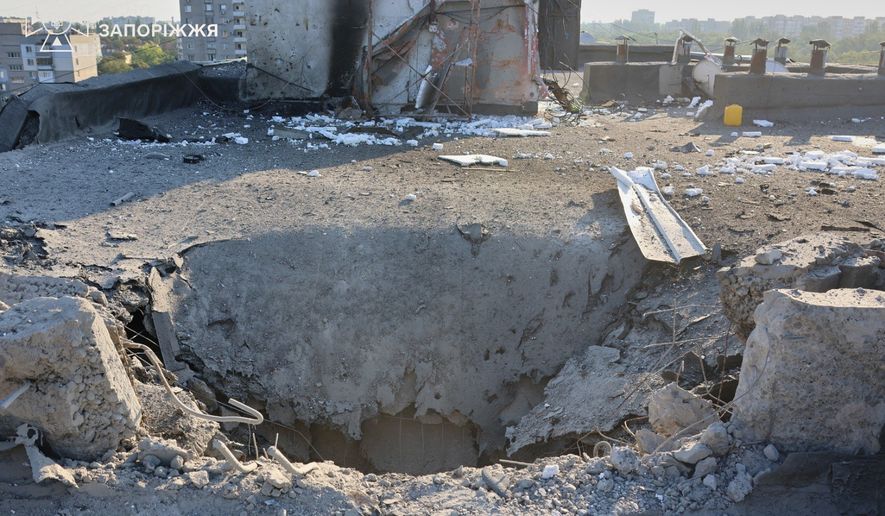 In this photo provided by the Ukrainian Emergency Service, a residential building is damaged following a Russian air attack in Zaporizhzhia, Ukraine, Thursday, Aug. 6, 2026. (Ukrainian Emergency Service via AP)