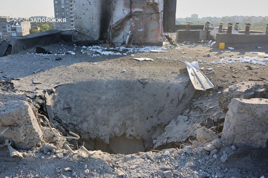 In this photo provided by the Ukrainian Emergency Service, a residential building is damaged following a Russian air attack in Zaporizhzhia, Ukraine, Thursday, Aug. 6, 2026. (Ukrainian Emergency Service via AP)