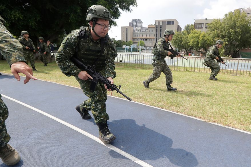 Soldiers attend the annual Han Kuang military exercises in Taipei, Taiwan, Wednesday, Aug. 5, 2026. (AP Photo/Chiang Ying-ying)