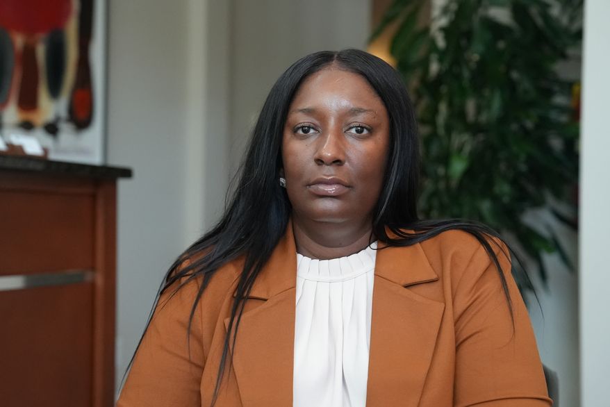 Cassandra Barksdale, who says she was wrongly diagnosed with cancer due to a tissue labelling mistake, poses at her attorney's office in Atlanta, Ga., Thursday, Aug. 6, 2026. (AP Photo/Emilie Megnien)
