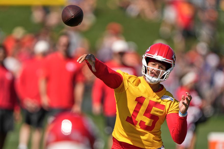 Kansas City Chiefs quarterback Patrick Mahomes throws during NFL football training camp Saturday, Aug. 1, 2026, in St. Joseph, Mo. (AP Photo/Charlie Riedel)