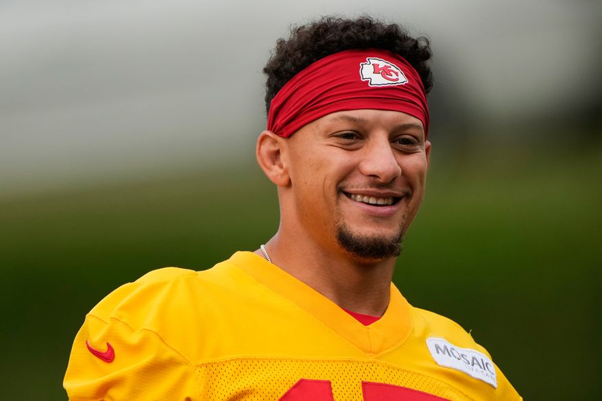 Kansas City Chiefs quarterback Patrick Mahomes (15) arrives at NFL football training camp Friday, July 31, 2026, in St. Joseph, Mo. (AP Photo/Charlie Riedel)