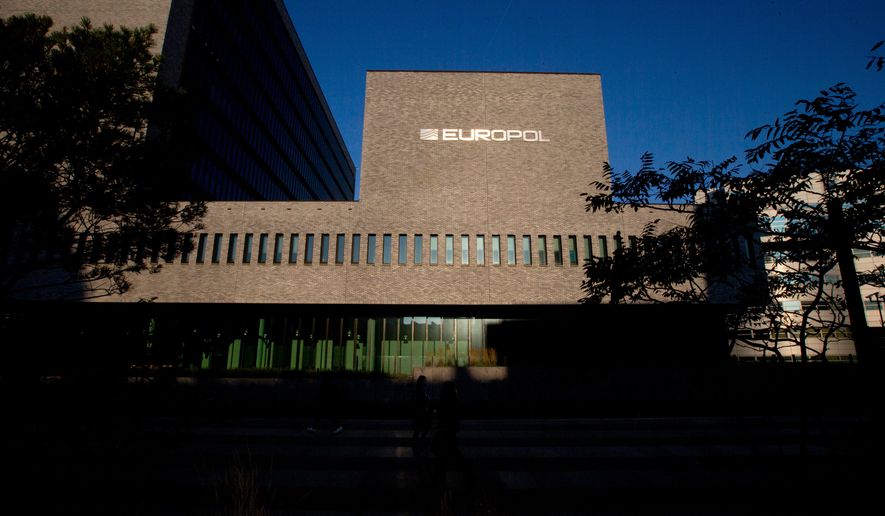 FILE- The Europol headquarters in The Hague, Netherlands, Wednesday, Oct. 10, 2018. (AP Photo/Peter Dejong, File)