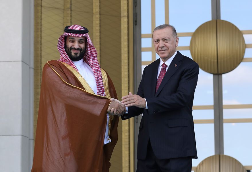FILE - Turkish President Recep Tayyip Erdogan, right, and Saudi Crown Prince Mohammed bin Salman shake hands during a welcome ceremony, in Ankara, Turkey, Wednesday, June 22, 2022. (AP Photo/Burhan Ozbilici, File)
