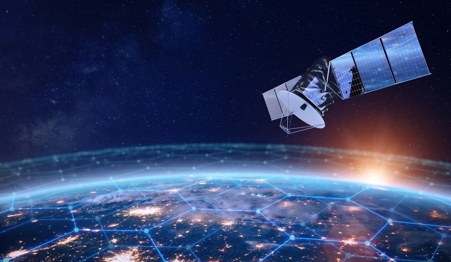 Telecommunication satellite providing global internet network and high speed data communication above Europe. Satellite in space, low Earth orbit. Worldwide data communication technology. Image credit: NicoElNino via Shutterstock.