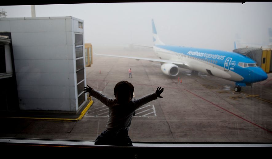 A child watches a plane at the Jorge Newbery airport in Buenos Aires, Argentina, April 14, 2016. (AP Photo/Natacha Pisarenko, File)