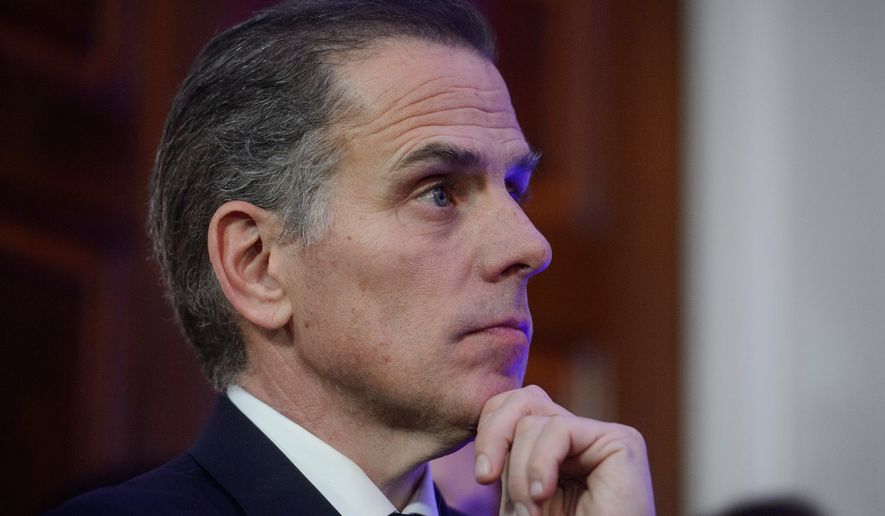 Hunter Biden listens while his father, President Joe Biden, speaks during a Hanukkah reception in the East Room of the White House in Washington, Dec. 16, 2024. (AP Photo/Rod Lamkey, Jr., File)