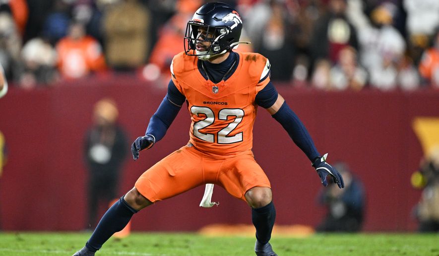 Denver Broncos safety Brandon Jones (22) defends during the first half of an NFL football game against the Washington Commanders, Nov. 30, 2025, in Landover, Md. (AP Photo/Terrance Williams, File)