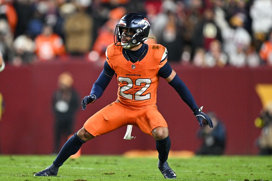 Denver Broncos safety Brandon Jones (22) defends during the first half of an NFL football game against the Washington Commanders, Nov. 30, 2025, in Landover, Md. (AP Photo/Terrance Williams, File)