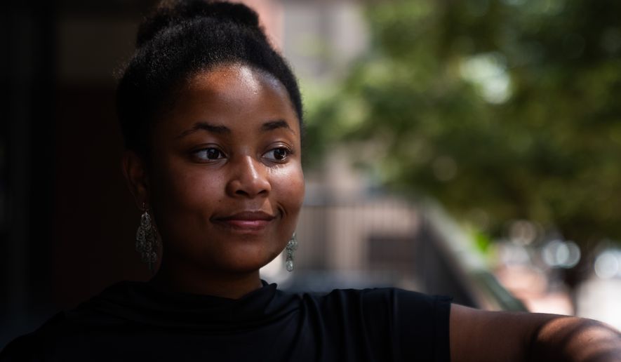 Howard University freshman Nikiyah Clark poses for a portrait on move-in day, Thursday, Aug. 6, 2026, in Washington. (AP Photo/Allison Robbert)