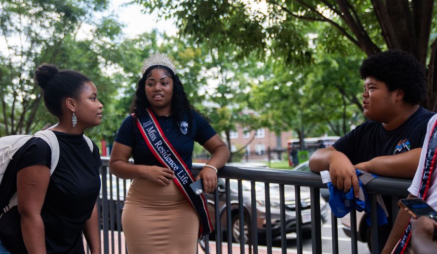 Howard University freshman Nikiyah Clark meets fellow students on move-in day, Thursday, Aug. 6, 2026, in Washington. (AP Photo/Allison Robbert)