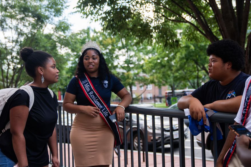Howard University freshman Nikiyah Clark meets fellow students on move-in day, Thursday, Aug. 6, 2026, in Washington. (AP Photo/Allison Robbert)