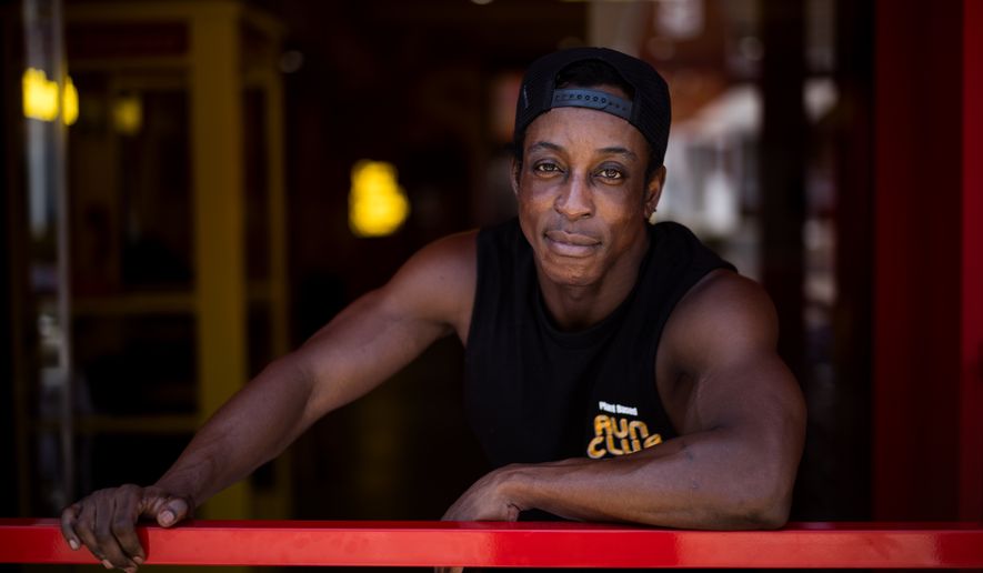 Shaka Smith, a vegan influencer who's politically an independent, poses for a portrait at his fast-food restaurant in Santa Monica, Calif., Thursday, Aug. 6, 2026. (AP Photo/Jae C. Hong)