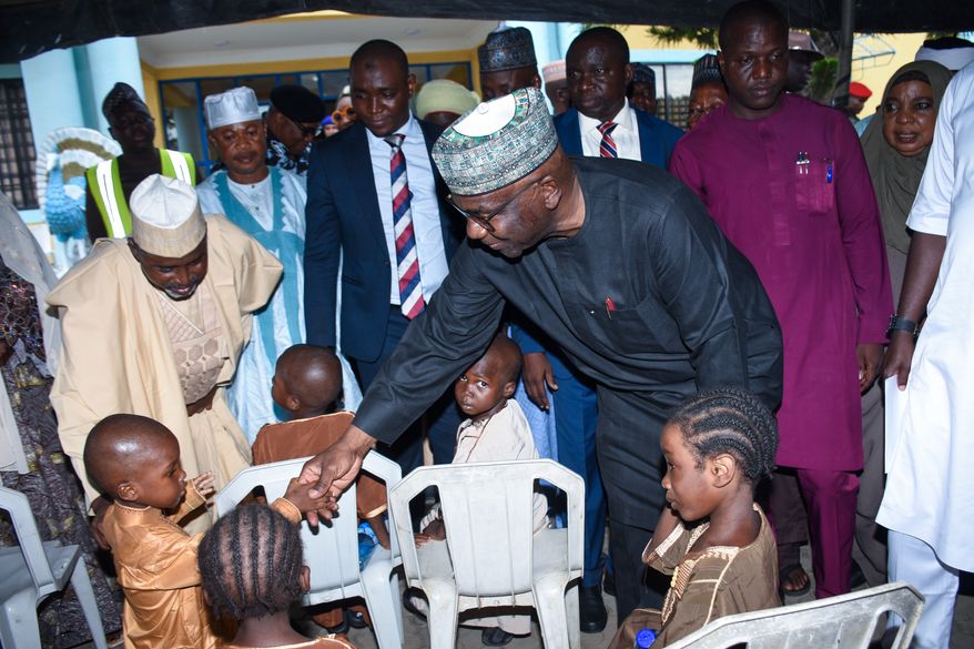 Kwara state Gov. Abdulrahman Abdulrazaq greets children at a hotel in Ilorin, Nigeria, Friday, Aug. 7, 2026, where they are staying after being rescued from a forest where they were held following their abduction from the Woro community by gunmen in February. (AP Photo/Abubakar Khadijat)