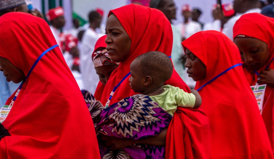 Nigerian brides attend a mass wedding ceremony in Kano, Nigeria, Saturday, Aug 8, 2026. (AP Photo/Sani Maikatanga)