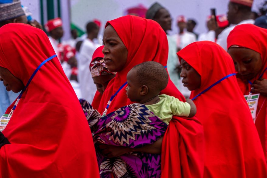 Nigerian brides attend a mass wedding ceremony in Kano, Nigeria, Saturday, Aug 8, 2026. (AP Photo/Sani Maikatanga)