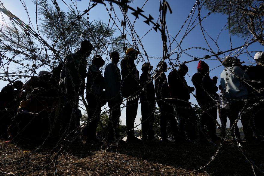 Malawian migrants stand in a queue for their deportation at a temporary centre, in Durban, South Africa, on June 18, 2026. (AP Photo/Themba Hadebe, file)