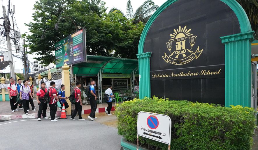 Students arrive at Debsirin Nonthaburi School, a day after the shooting at the school, in Nonthaburi province, Thailand Saturday, Aug. 8, 2026. (AP Photo/Sakchai Lalit)