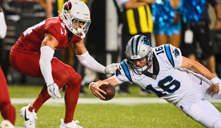 Carolina Panthers quarterback Haynes King (16) dives into the endzone next to Arizona Cardinals safety Isaiah Oliver, left, to win the game on the last play of the game in the second half of the Pro Football Hall of Fame NFL preseason game in Canton, Ohio, Thursday, Aug. 6, 2026. (AP Photo/David Richard)