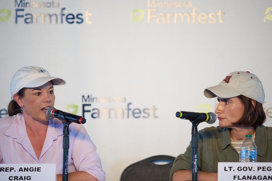 U.S. Rep. Angie Craig, D-Minn., left, and Minnesota Lt. Gov. Peggy Flanagan participate in a forum for U.S. Senate candidates at Farmfest Wednesday, Aug. 5, 2026, in Morgan, Minn. (AP Photo/Ellen Schmidt)
