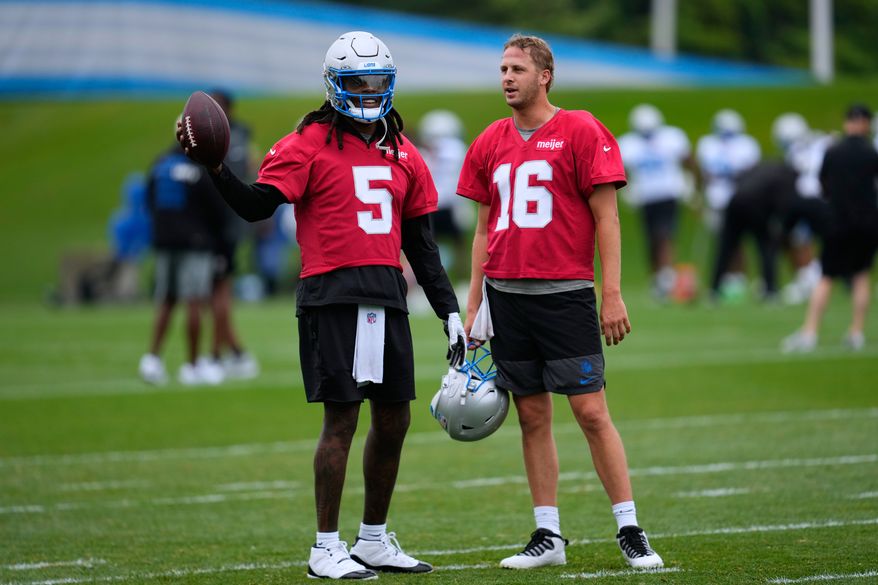 Detroit Lions quarterbacks Teddy Bridgewater (5) talks with Jared Goff (16) during practice at the NFL football team's training camp, in Allen Park, Mich., Sunday, Aug. 2, 2026. (AP Photo/Paul Sancya)