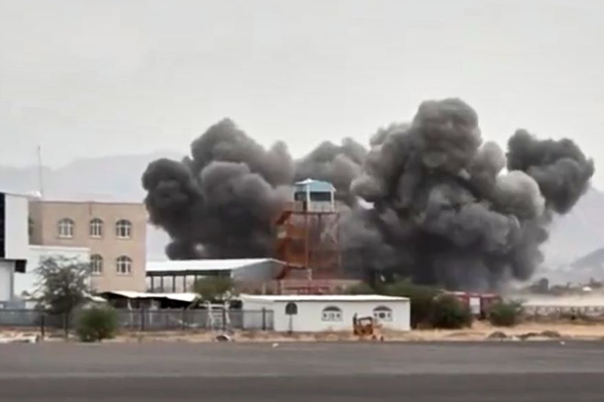 FILE - This image taken from video broadcast by Al-Masirah TV, a Houthi-controlled news channel, shows an explosion at the Sanaa International Airport compound during what the Iranian-backed Houthi rebels in Yemen said were several Saudi airstrikes in Sanaa, Yemen, July 13, 2026. (Al-Masirah TV via AP, File)