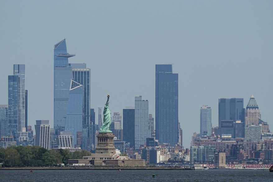 FILE - The New York skyline and Statue of Liberty are seen on May 12, 2025. (AP Photo/Matt Rourke, File)