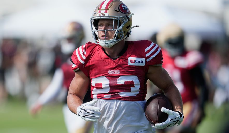 San Francisco 49ers running back Christian McCaffrey (23) runs during the NFL football team's training camp, Thursday, Aug. 6, 2026, in Santa Clara, Calif. (AP Photo/Jeff Chiu)