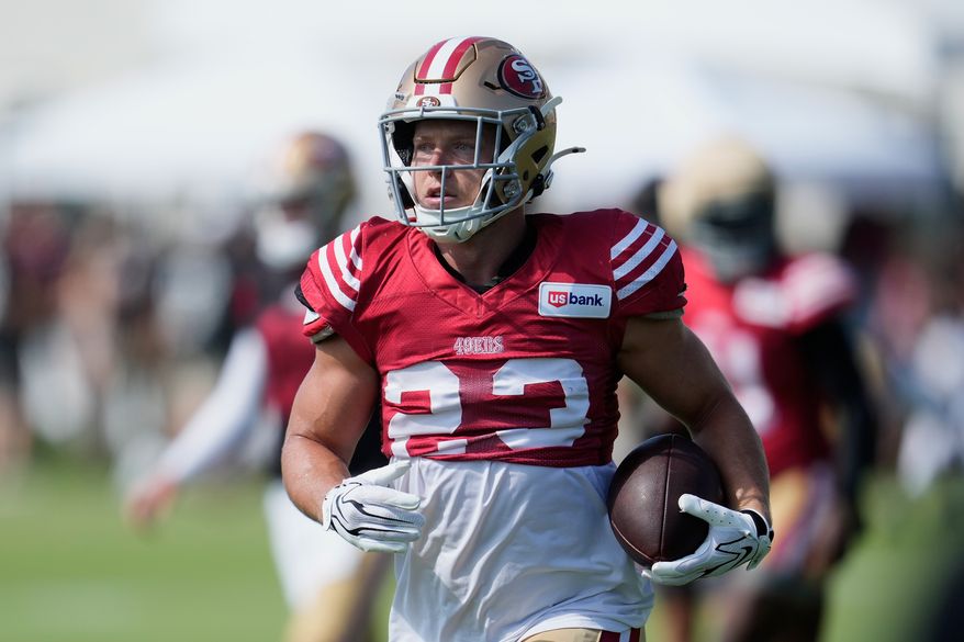 San Francisco 49ers running back Christian McCaffrey (23) runs during the NFL football team's training camp, Thursday, Aug. 6, 2026, in Santa Clara, Calif. (AP Photo/Jeff Chiu)