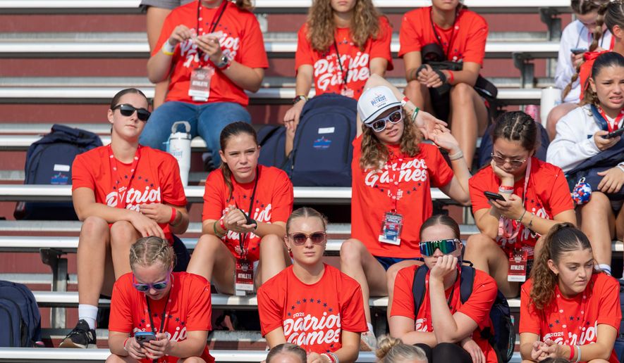 Participates look on during day one of the Patriot Games, Sunday, Aug. 9, 2026, in Geneva, Ohio. (AP Photo/Nate Manley)