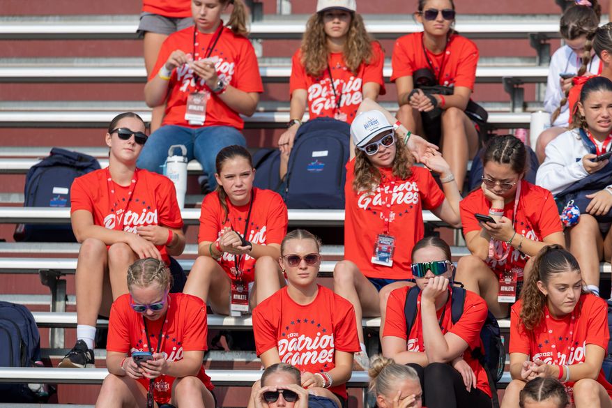 Participates look on during day one of the Patriot Games, Sunday, Aug. 9, 2026, in Geneva, Ohio. (AP Photo/Nate Manley)