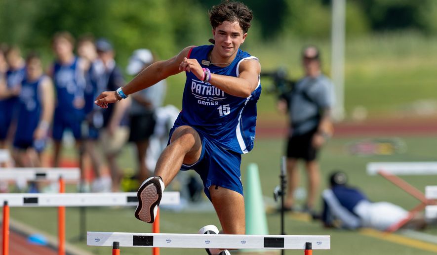Tyler Gorrell of Indiana participates in the 55 meter hurdles during day one of the Patriot Games, Sunday, Aug. 9, 2026, in Geneva, Ohio. (AP Photo/Nate Manley)