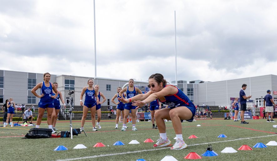 Milla Wiechert of Iowa participates in the broad jump during day one of the Patriot Games, Sunday, Aug. 9, 2026, in Geneva, Ohio. (AP Photo/Nate Manley)