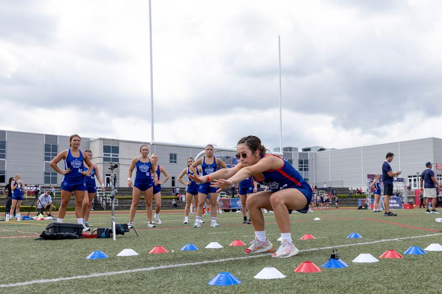 Milla Wiechert of Iowa participates in the broad jump during day one of the Patriot Games, Sunday, Aug. 9, 2026, in Geneva, Ohio. (AP Photo/Nate Manley)
