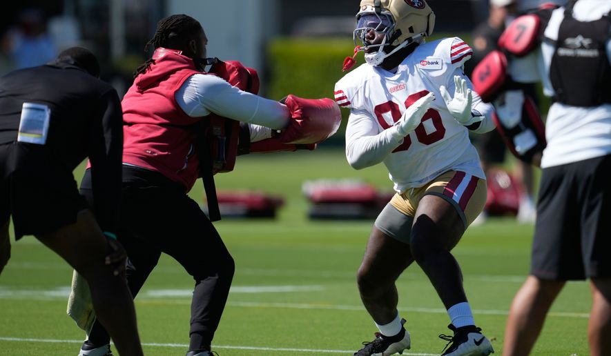 FILE - San Francisco 49ers' Cameron Sample, right, attends the NFL football team's training camp, July 31, 2026, in Santa Clara, Calif. (AP Photo/Jeff Chiu, File)