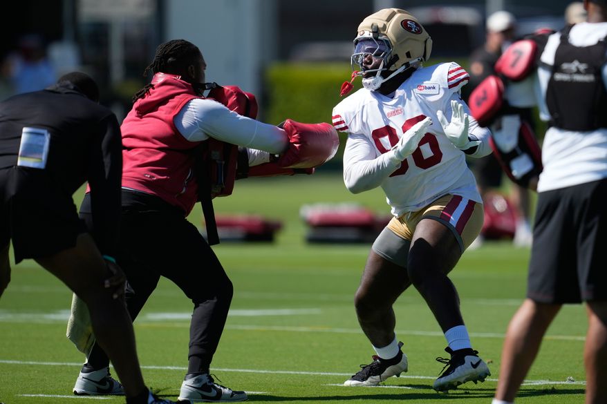 FILE - San Francisco 49ers' Cameron Sample, right, attends the NFL football team's training camp, July 31, 2026, in Santa Clara, Calif. (AP Photo/Jeff Chiu, File)