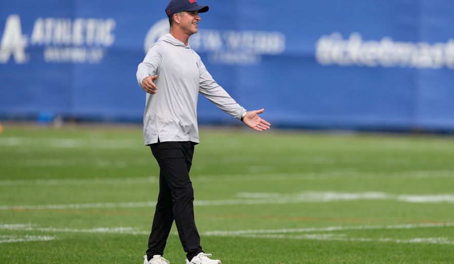 New York Giants head coach John Harbaugh greets people after a practice at the team's NFL football facilities in East Rutherford, N.J., Monday, Aug. 10, 2026. (AP Photo/Seth Wenig)