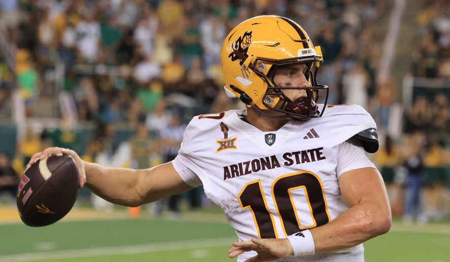 FILE - Arizona State quarterback Sam Leavitt looks to pass in the second half of an NCAA college football game against Baylor, Sept. 20, 2025, in Waco, Texas. (AP Photo/Jerry Larson, File)