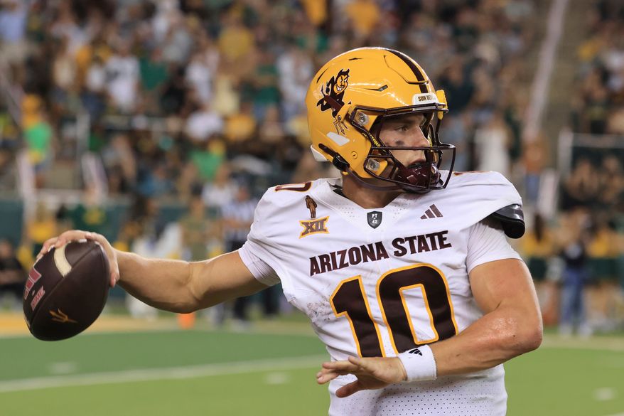 FILE - Arizona State quarterback Sam Leavitt looks to pass in the second half of an NCAA college football game against Baylor, Sept. 20, 2025, in Waco, Texas. (AP Photo/Jerry Larson, File)