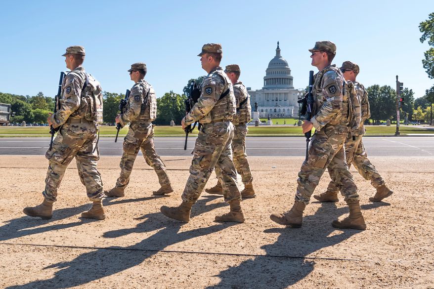 Armed National Guard soldiers from West Virginia patrol the Mall near the Capitol in Washington, as part of President Donald Trump's order to impose federal law enforcement in the nation's capital, Aug. 26, 2025. (AP Photo/J. Scott Applewhite, File)