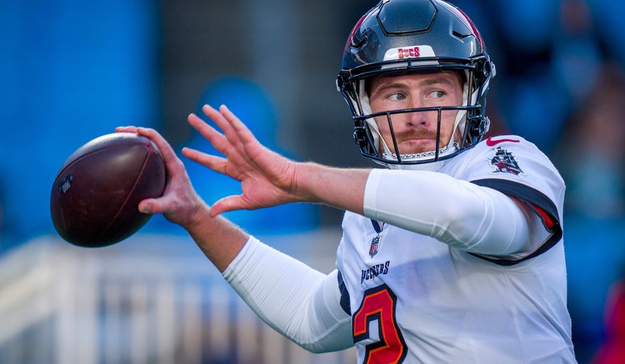 FILE - Tampa Bay Buccaneers quarterback Kyle Trask warms up before an NFL football game against the Carolina Panthers, Dec. 1, 2024, in Charlotte, N.C. (AP Photo/Rusty Jones, File)