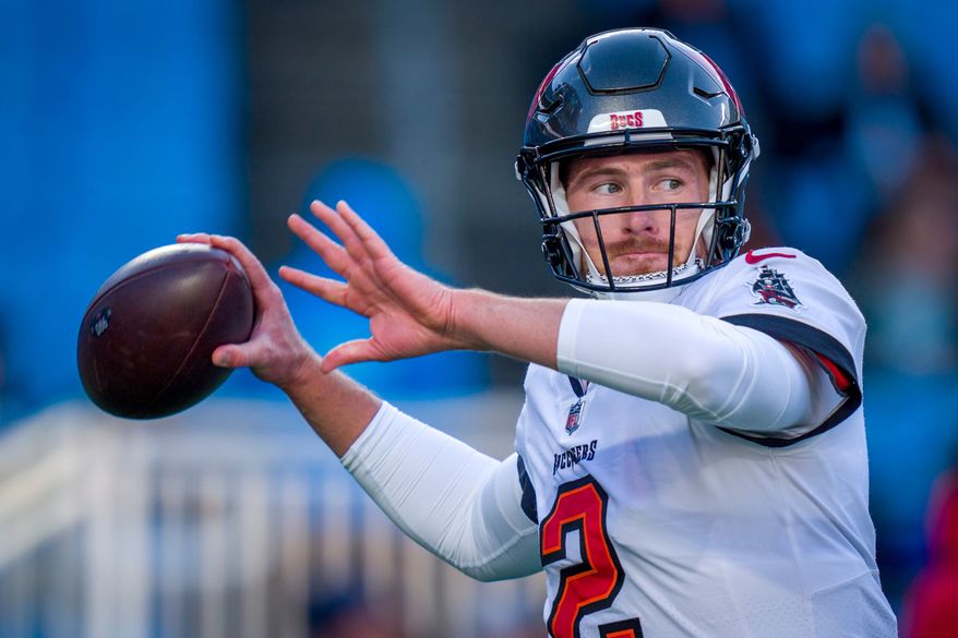 FILE - Tampa Bay Buccaneers quarterback Kyle Trask warms up before an NFL football game against the Carolina Panthers, Dec. 1, 2024, in Charlotte, N.C. (AP Photo/Rusty Jones, File)
