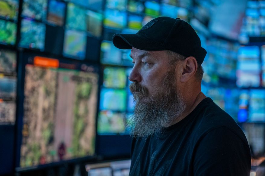 Maj. Robert "Magyar" Brovdi stands in the control room during a long-range unmanned aerial vehicle operation targeting Russian positions in an undisclosed location in Ukraine on Friday, Aug. 7, 2026. (AP Photo/Dan Bashakov)