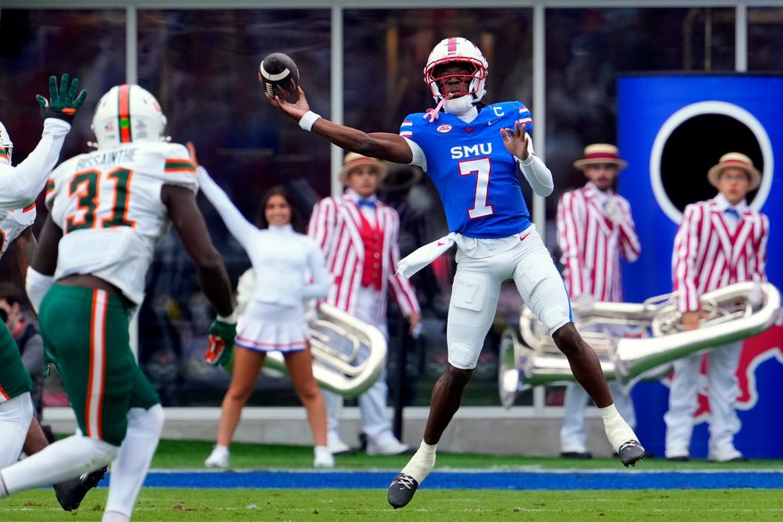 FILE - SMU quarterback Kevin Jennings throws a pass during an NCAA college football game against Miami, Nov. 1, 2025, in Dallas. (AP Photo/Jeffrey McWhorter, File)
