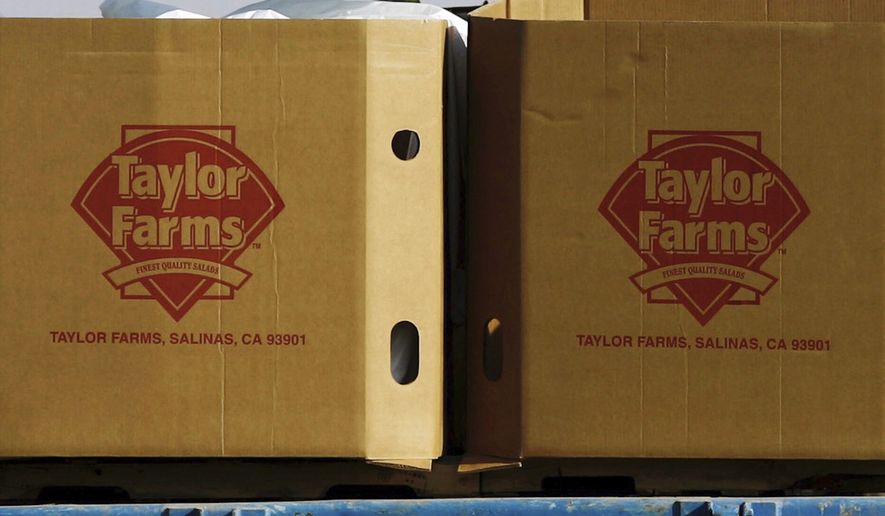 Taylor Farms boxes are loaded on a field in the town of Doctor Mora, on the central state of Guanajuato, Mexico, March 26, 2008. (AP Photo/Guillermo Arias, File)